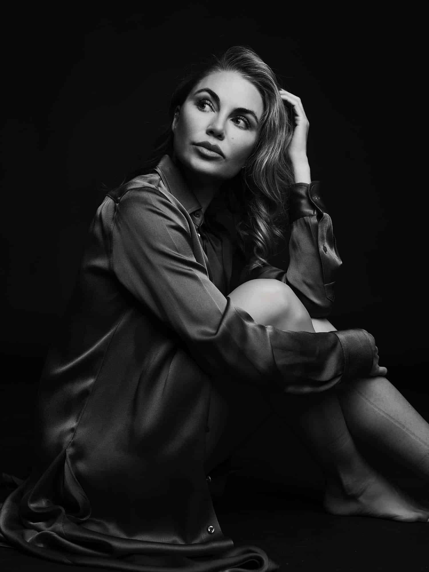 Woman with natural beauty in a silk blouse, representing gradual collagen restoration