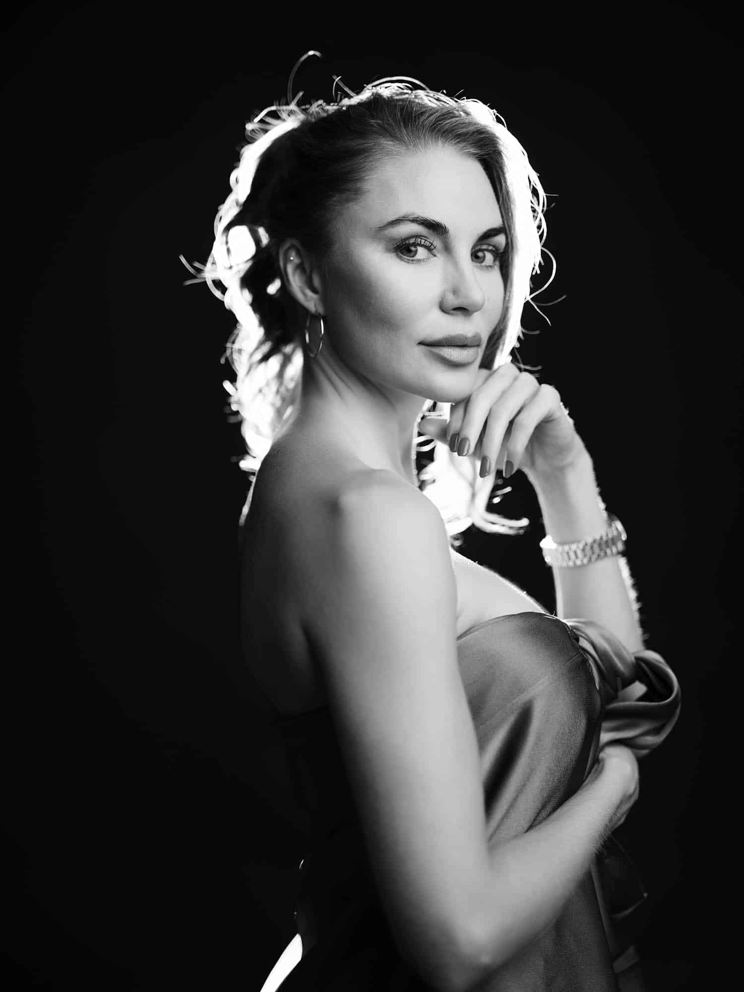 Woman with defined jawline and lifted features, black and white glamour portrait